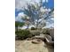 Backyard featuring a stone fire pit, patio and built in bench at 6887 S Teresa Dr, Chandler, AZ 85249