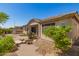 Well-manicured backyard with a stone bridge over a small pond and a built-in BBQ area for outdoor entertaining at 6887 S Teresa Dr, Chandler, AZ 85249