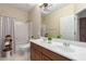 Large bathroom with double sinks, big mirrors, and a shower-tub combo at 6887 S Teresa Dr, Chandler, AZ 85249