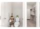 Bathroom featuring toilet and access to the large walk-in closet with many built-ins at 6887 S Teresa Dr, Chandler, AZ 85249