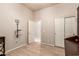 Spacious bedroom with a mounted TV, modern desk and closet space at 6887 S Teresa Dr, Chandler, AZ 85249