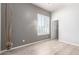 Bedroom with light wood floors, plantation shutters, and two tone paint at 6887 S Teresa Dr, Chandler, AZ 85249