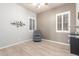 Bedroom featuring light wood floors and plantation shutters for lots of natural light at 6887 S Teresa Dr, Chandler, AZ 85249