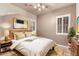 Charming bedroom with ceiling fan, natural lighting, and modern furniture at 6887 S Teresa Dr, Chandler, AZ 85249
