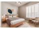 Comfortable bedroom with natural lighting from the large windows and ceiling fan at 6887 S Teresa Dr, Chandler, AZ 85249