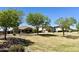 Beautiful community park with grassy areas, mature trees, and residential views at 6887 S Teresa Dr, Chandler, AZ 85249