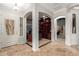 Welcoming foyer with tile flooring, architectural columns, and views into office at 6887 S Teresa Dr, Chandler, AZ 85249