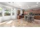 Spacious kitchen featuring a breakfast bar, tile floors, and natural light at 6887 S Teresa Dr, Chandler, AZ 85249