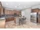 Modern kitchen with granite countertops and stainless steel appliances at 6887 S Teresa Dr, Chandler, AZ 85249