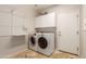 Clean and organized laundry room featuring a washer and dryer at 6887 S Teresa Dr, Chandler, AZ 85249