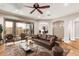 Cozy living room featuring hardwood floors, neutral walls, and access to outdoor patio at 6887 S Teresa Dr, Chandler, AZ 85249
