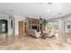 Spacious living room with a stone fireplace and travertine flooring at 6887 S Teresa Dr, Chandler, AZ 85249