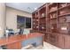 Executive home office with custom built-ins and natural light at 6887 S Teresa Dr, Chandler, AZ 85249