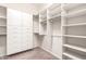 Large walk-in closet with drawers, shelves and hanging areas to maximize storage at 6887 S Teresa Dr, Chandler, AZ 85249