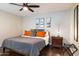 Relaxing bedroom with hardwood floors, a ceiling fan, and coordinated decor creating a peaceful retreat at 7625 E Camelback Rd # A110, Scottsdale, AZ 85251