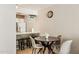 Cozy dining area adjacent to the kitchen with a round table and seating for four at 7625 E Camelback Rd # A110, Scottsdale, AZ 85251