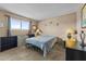 Simple bedroom features neutral colors and a window, creating a calm and restful atmosphere for relaxation and sleep at 90 W Yavapai St # 20, Wickenburg, AZ 85390