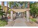 Charming community entrance features lush landscaping and a welcoming sign for residents and guests at 90 W Yavapai St # 20, Wickenburg, AZ 85390