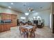 Open-concept living area complete with dining area and kitchen features modern lighting and inviting furniture at 907 W Restin Rd, Phoenix, AZ 85086