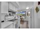 Bright kitchen features white appliances, tile flooring, and a breakfast nook with a window at 9560 W Country Club Dr, Sun City, AZ 85373