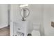 Stylish bathroom featuring a modern vanity, elegant mirror, and contemporary fixtures at 9606 W Shasta Dr, Sun City, AZ 85351