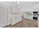 Modern kitchen featuring sleek cabinetry, stainless steel appliances, and open layout at 9606 W Shasta Dr, Sun City, AZ 85351
