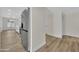 Stainless steel refrigerator in a modern kitchen with wood floors and neutral decor at 9606 W Shasta Dr, Sun City, AZ 85351