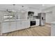 Spacious kitchen with stainless appliances, updated cabinets, and large island at 9606 W Shasta Dr, Sun City, AZ 85351