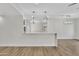 Large, open floor plan with a breakfast bar connecting the kitchen at 9606 W Shasta Dr, Sun City, AZ 85351