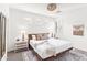 Serene bedroom with white bedding, neutral accents, plantation shutters, and natural light at 9921 E South Bend Dr, Scottsdale, AZ 85255