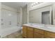 Spacious bathroom featuring double sinks, a tub-shower combo, and tile flooring at 10226 E Pine Valley Rd, Scottsdale, AZ 85255