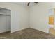 A bedroom with neutral tones, carpet, closet, and easy access to another room, creating versatility at 10226 E Pine Valley Rd, Scottsdale, AZ 85255