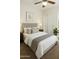 Comfortable bedroom featuring a well-appointed bed, neutral décor and a ceiling fan at 10226 E Pine Valley Rd, Scottsdale, AZ 85255