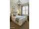 Relaxing bedroom with a comfortable bed, soft blue accents and natural light from a window at 10226 E Pine Valley Rd, Scottsdale, AZ 85255