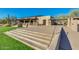Exterior of community clubhouse featuring desert landscaping and outdoor seating at 10226 E Pine Valley Rd, Scottsdale, AZ 85255