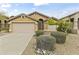 Charming single-story home with a two-car garage and low maintenance desert landscaping at 10226 E Pine Valley Rd, Scottsdale, AZ 85255