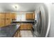 Bright kitchen with stainless steel appliances, island, and tiled flooring at 10226 E Pine Valley Rd, Scottsdale, AZ 85255
