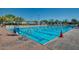 Bright, outdoor swimming pool with marked lanes and lifeguard stand on a sunny day at 10226 E Pine Valley Rd, Scottsdale, AZ 85255