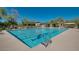 Resort-style pool with lane dividers, deck chairs and umbrellas with community buildings at 10226 E Pine Valley Rd, Scottsdale, AZ 85255