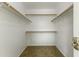 Walk-in closet with ample shelving and storage at 10226 E Pine Valley Rd, Scottsdale, AZ 85255