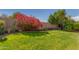 Well-maintained backyard featuring lush grass, shrubs, and a block wall at 10359 E Jacob Ave, Mesa, AZ 85209