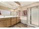 Bathroom featuring double sinks, a bathtub, a shower, and plenty of cabinet space at 10359 E Jacob Ave, Mesa, AZ 85209