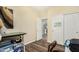 Cozy bedroom with wood-look floors, closet, and view of the home's interior at 10359 E Jacob Ave, Mesa, AZ 85209