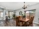 Dining area with chandelier, wood table, and ample natural light at 10359 E Jacob Ave, Mesa, AZ 85209
