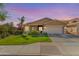 Charming single-story home with well-manicured lawn and desert landscaping at 10359 E Jacob Ave, Mesa, AZ 85209