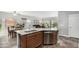Spacious kitchen with an island and a view of dining area and backyard at 10359 E Jacob Ave, Mesa, AZ 85209