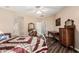 Traditional main bedroom featuring neutral walls, wood-look floors, and vintage furniture at 10359 E Jacob Ave, Mesa, AZ 85209