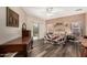 A traditional bedroom features a ceiling fan, wooden floors, and a sliding glass door at 10359 E Jacob Ave, Mesa, AZ 85209