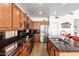 Well-equipped kitchen with stainless steel appliances and dark granite countertops at 10434 E Jacob Ave, Mesa, AZ 85209