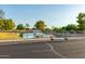 Community pond with a fountain and walkway, offering a peaceful outdoor space at 10659 W Yukon Dr, Peoria, AZ 85382